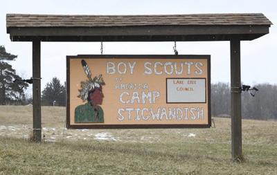 Boy Scouts Camp Stigwandish entrance sign with wooden frame in a frosty Lake Erie field.