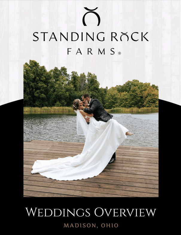 Bride and groom share a romantic lakeside moment at Standing Rock Farms in Madison, Ohio.