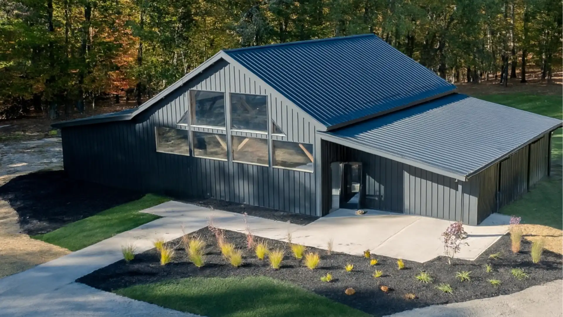 1837 Barn wedding venue at Standing Rock Farms in Madison Ohio aerial view showing historic restored barn surrounded by woodland and open lawn